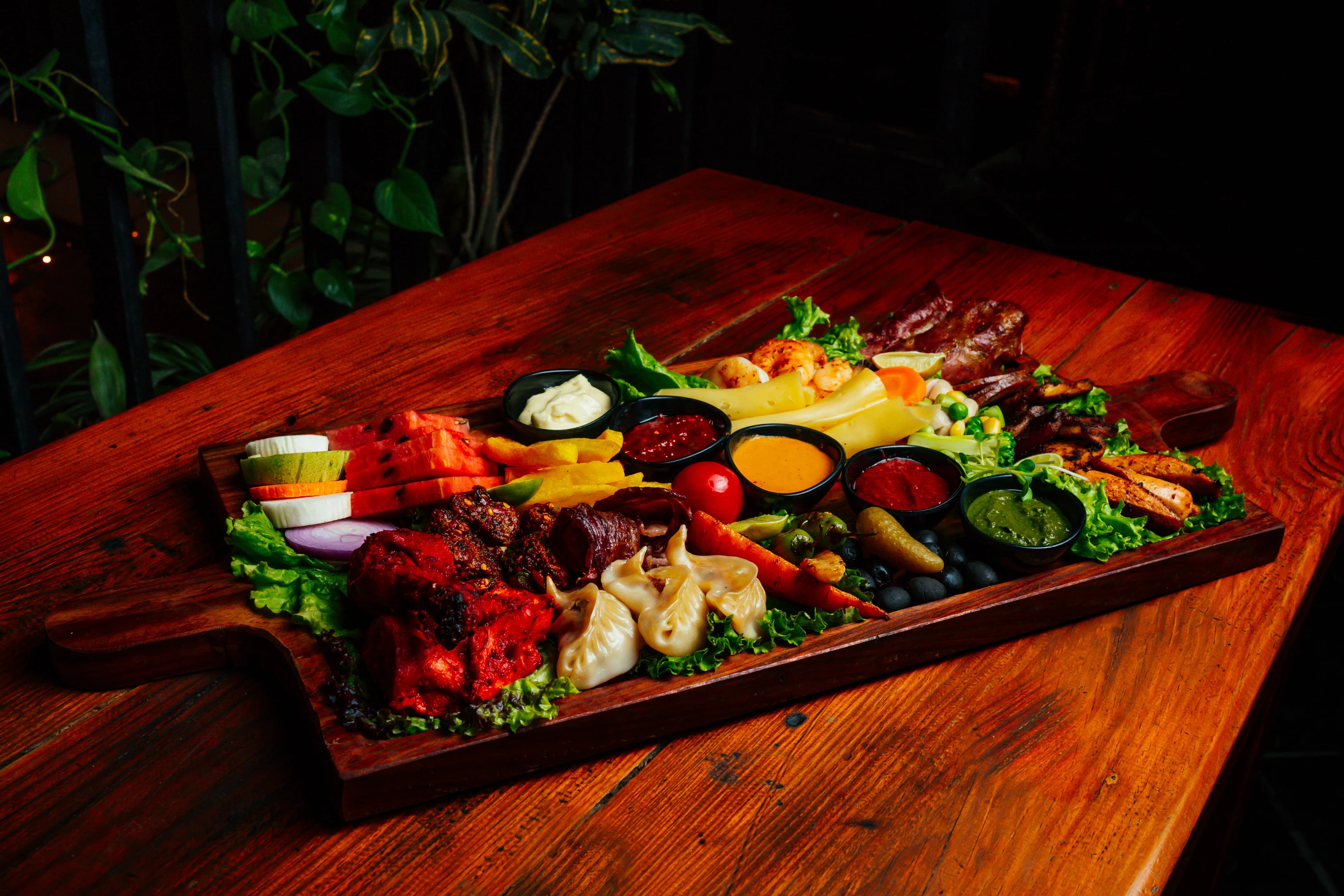 Mixed grill platter on a wooden board