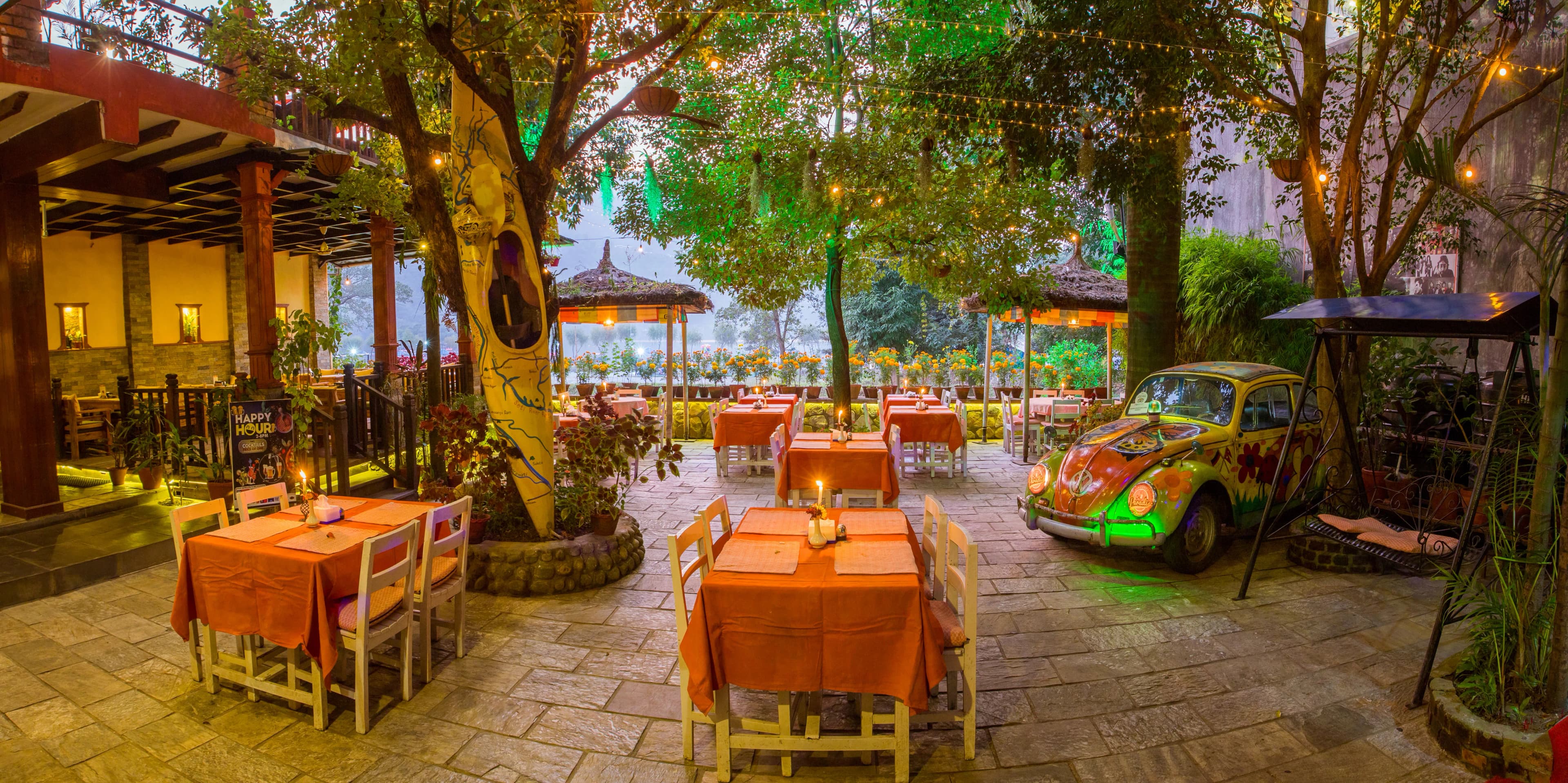 The garden by day, tables under the trees